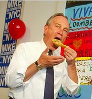 NYC Mayor Michael Bloomberg stuffing his piehole